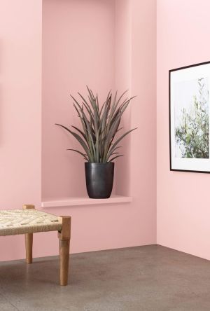Interior painting preparation and finish work in a residential room.