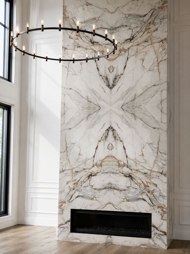 Book-matched marble fireplace feature wall completed by Crestalon.